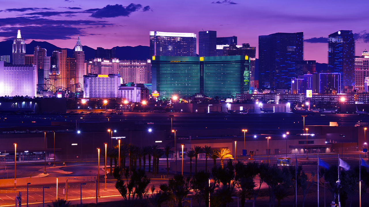 A photo of the Last Vegas strip with a purple hue