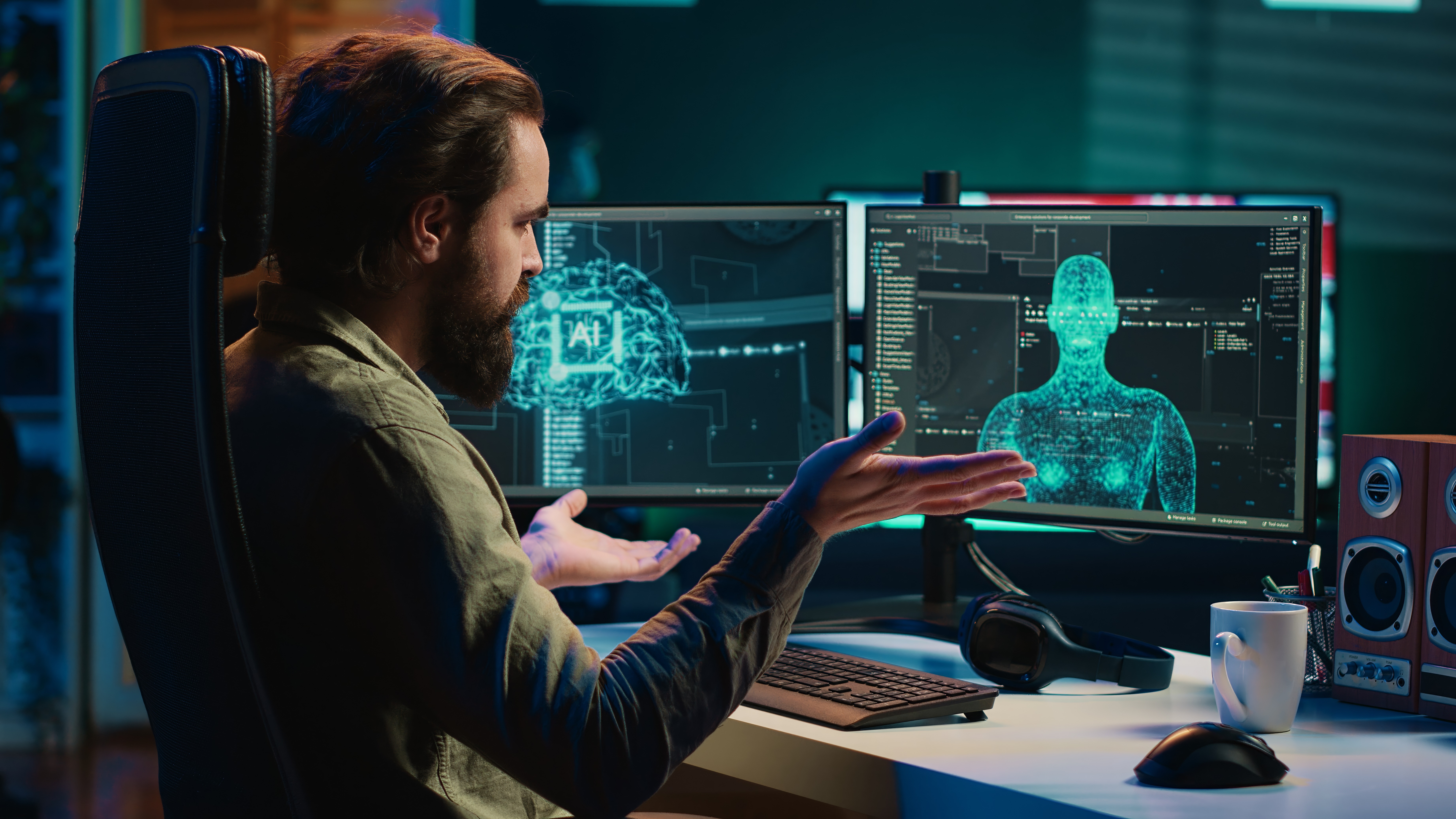 Man sits at desk talking with AI on computer